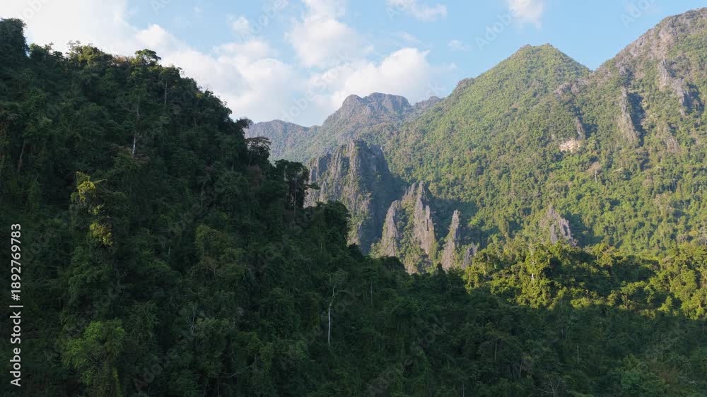custom made wallpaper toronto digitalParagliders fly in front of sun over Vang Vieng mountains in Laos during a scenic orange sunset, shot from unique tripod aerial perspective