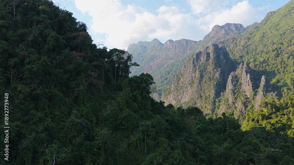 custom made wallpaper toronto digitalTripod aerial shot of paraglider soaring over Laos mountains during orange sunset with sun setting behind silhouette of peaks
