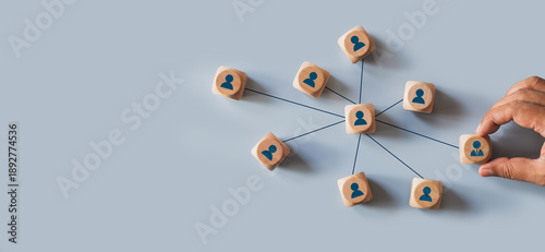 Organizational network structure with connected people icons on wooden blocks, showing team collaboration, stakeholder mapping, social graph, and business communication on a light background