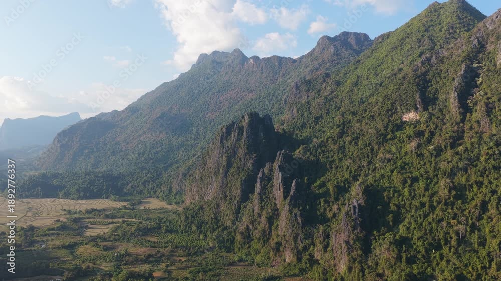 custom made wallpaper toronto digitalScenic aerial landscape revealing valley with karst mountains, dry rice paddies, and a village in Vang Vieng, Laos, Southeastern Asia