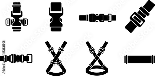 Collection of black strap buckles and harnesses on a white background