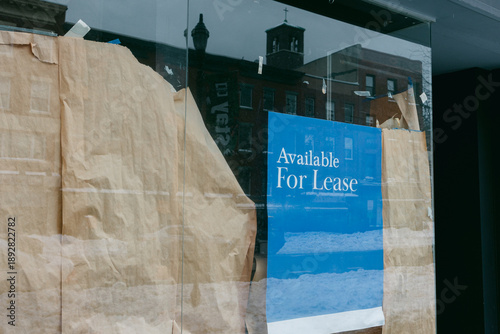 Photos Storefront is empty and closed with a leasing sign in a city street during winte