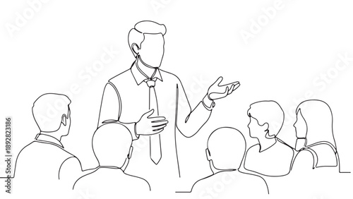 Presentation speaker addressing a group of listeners in a business meeting or conference