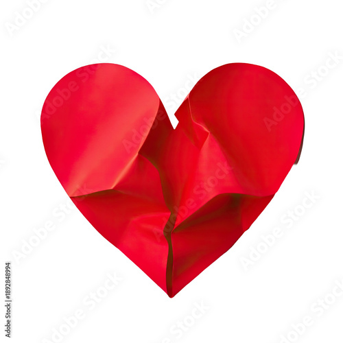 A single, delicate, red paper heart is lying on a clean white background
