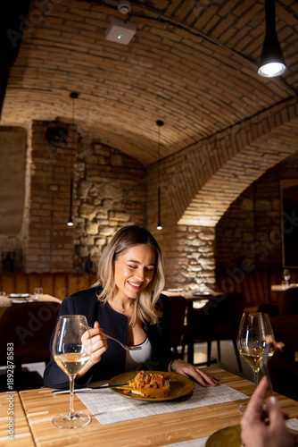 Woman enjoys dinner in a re...