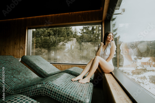 Woman relaxes in spa area w...
