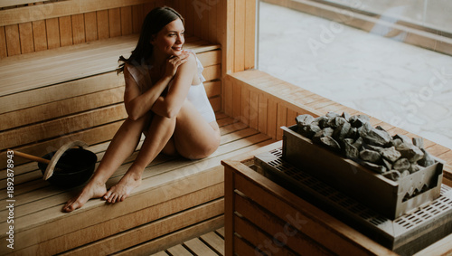Woman enjoys time in sauna ...