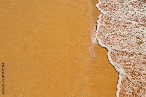 Golden beach sand and Wave foam