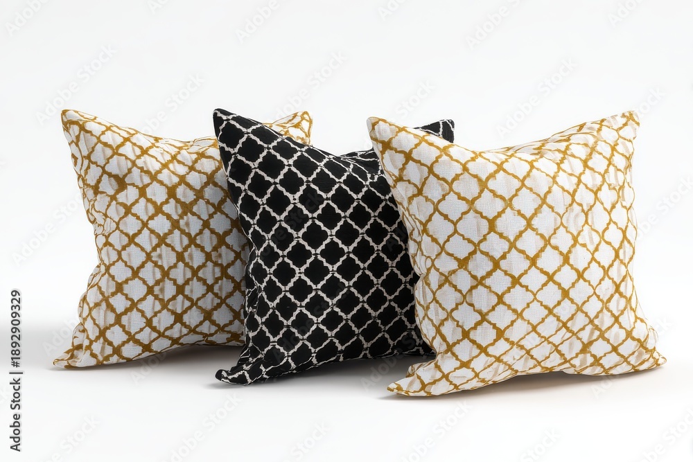 Fototapeta premium Luxurious Pillows Trio: Three designer pillows, each adorned with a unique geometric pattern, rest in an inviting display, showcasing a symphony of textures and subtle shades.