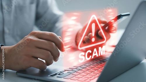 Warning of online scam: user encountering digital fraud while using laptop and mobile phone