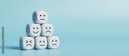 world mental health day concept or feedback rating and positive customer review, wood cube stacking with emotion face icon on blue background 

