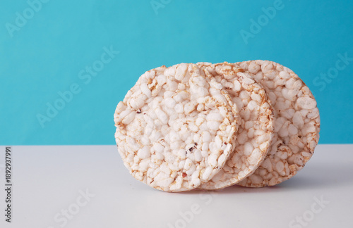 Round rice loaves on blue background