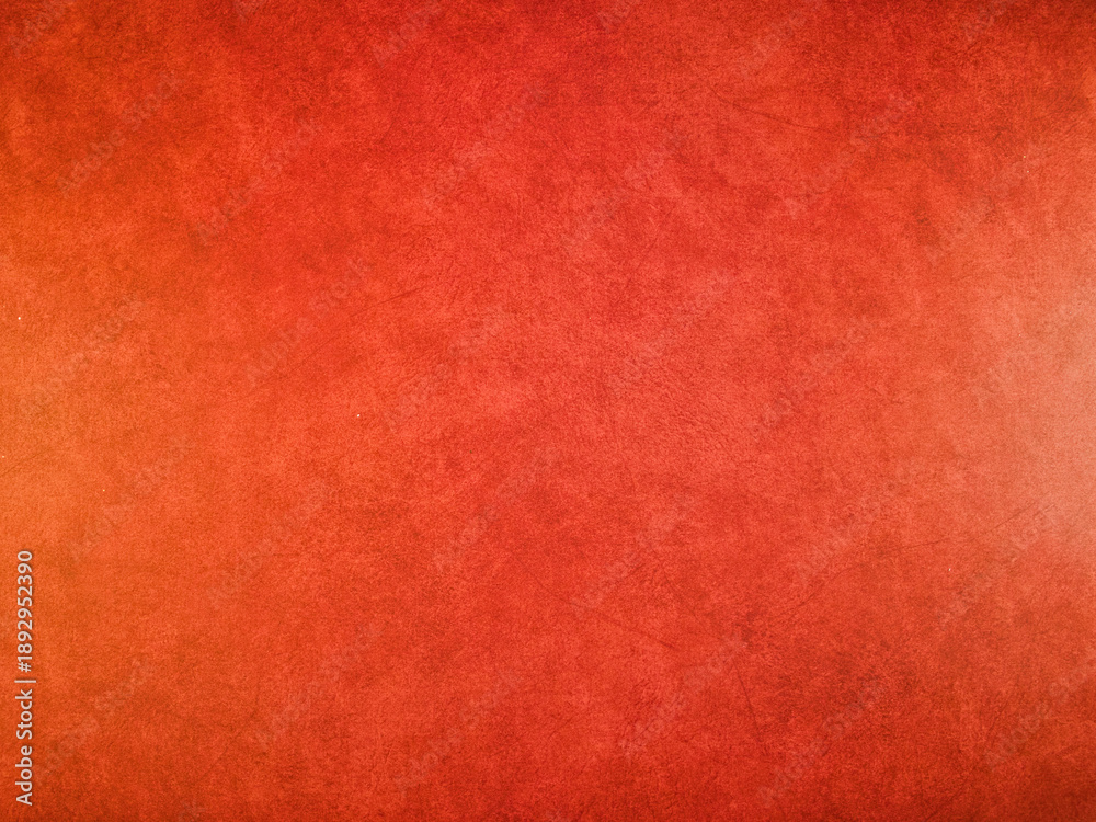 Fototapeta premium Vibrant Red Orange Grunge Texture Background - Dynamic red and orange textured background with a rustic, grunge effect. Ideal for web design, graphic projects, presentations, and artistic backdrops.