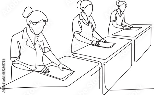 Medical professionals working together at tables examining documents and equipment in a clinical environment from a high viewpoint