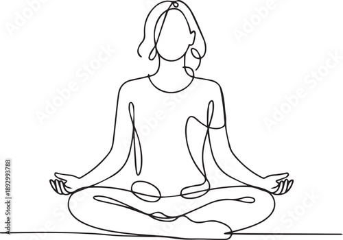 Serene woman meditating in lotus position with peaceful expression