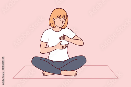Young woman sitting on a yoga mat performs a breast self-examination to detect early signs of cancer. Concept of wellness, proactive health screening, and self-care during awareness month.