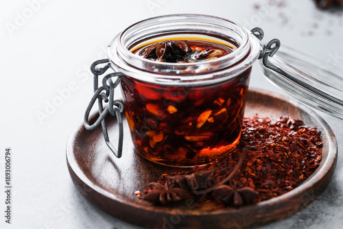 Spicy chili crisp oil sauce with roasted salted peanuts