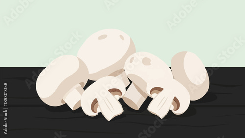 A group of fresh white mushrooms rest on a dark surface against a light background