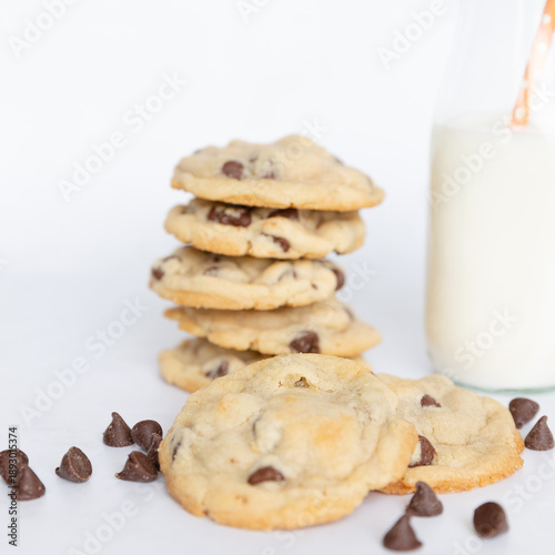 Stack of chocolate chip cookies with milk