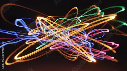Abstract Light Trails - Colorful Swirls and Motion Against Black Background.