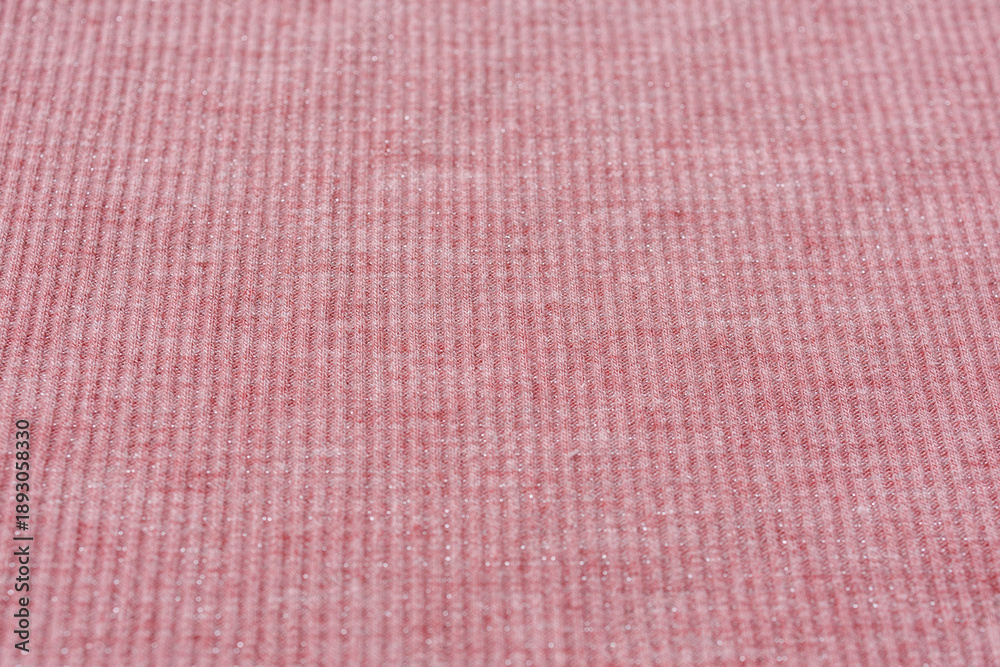 Fototapeta premium Soft pink ribbed knitted fabric with glitter thread for fashion design and sewing hobby