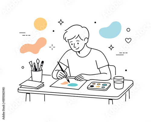 Creative Painting Session. Creative hobbies. A person painting at a small desk with brushes and paper neatly arranged. Calm focus and self-expression with