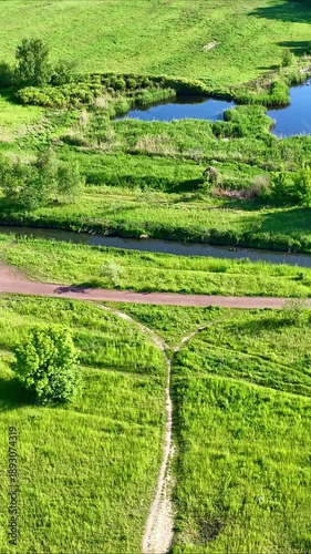 Aerial View of Urban City Park with Pond and Recreational Area for Leisure
