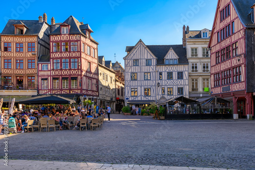 Tableau sur toile Street with timber framing houses and tables of restaurant in Rouen, Normandy, France