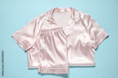 Принти на полотні Stylish pyjamas on light blue background, top view