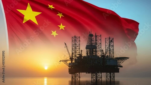 Offshore oil drilling platform at sunset with the national flag of China in the background, concept of Chinese energy sector and fuel resources.
