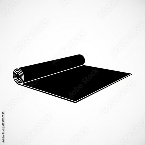 Black yoga mat rolled up partially on for exercise