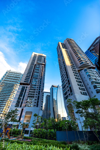 Modern residential buildings seen from a low angle during dusk in Sao Paulo, Brazil.