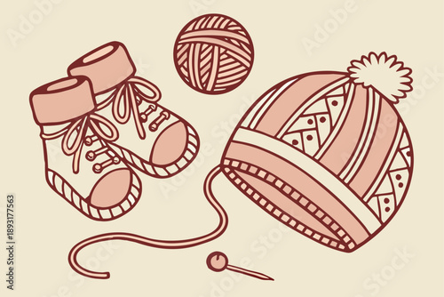 Handknitted winter accessories - baby booties, yarn ball, and knitted hat