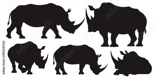 Set of black rhinoceros silhouettes in various poses