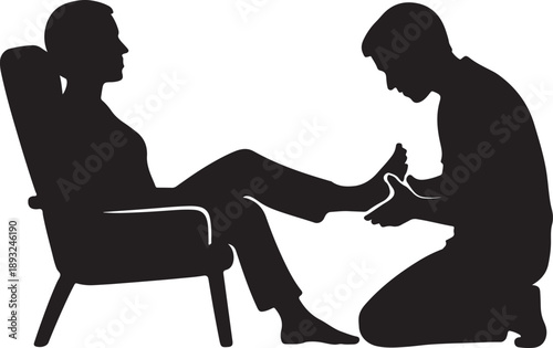 Silhouette of person relaxing with foot massage
