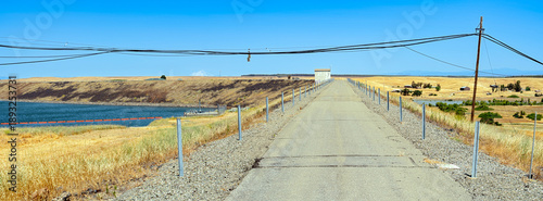 фотографія Panorama of the road across the earthen Black Butte Dam and adjacent farmland ne