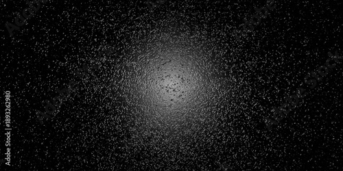 Φωτογραφία gritty black texture with subtle radial illumination emerges from the center, wh