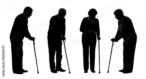 Silhouettes of four elderly people with walking canes standing together.