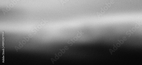Monochrome abstract gradient texture with vintage film noise.