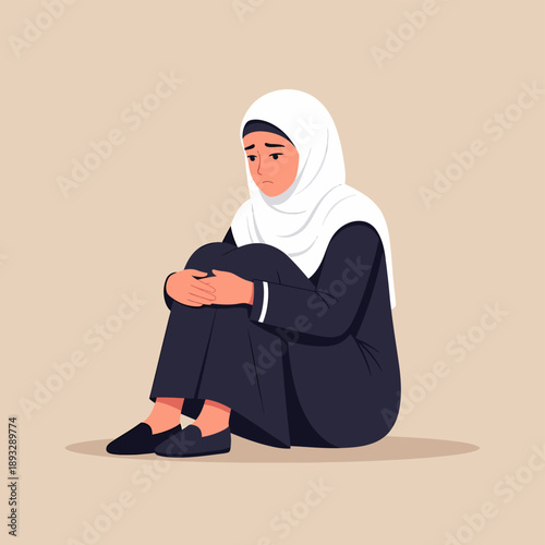 Muslim woman in hijab sitting sadly on the floor ramadan.