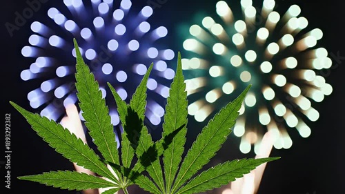 Green Marijuana Leaf with Blurry Colorful Bokeh Lights in Dark Background Celebration Atmosphere