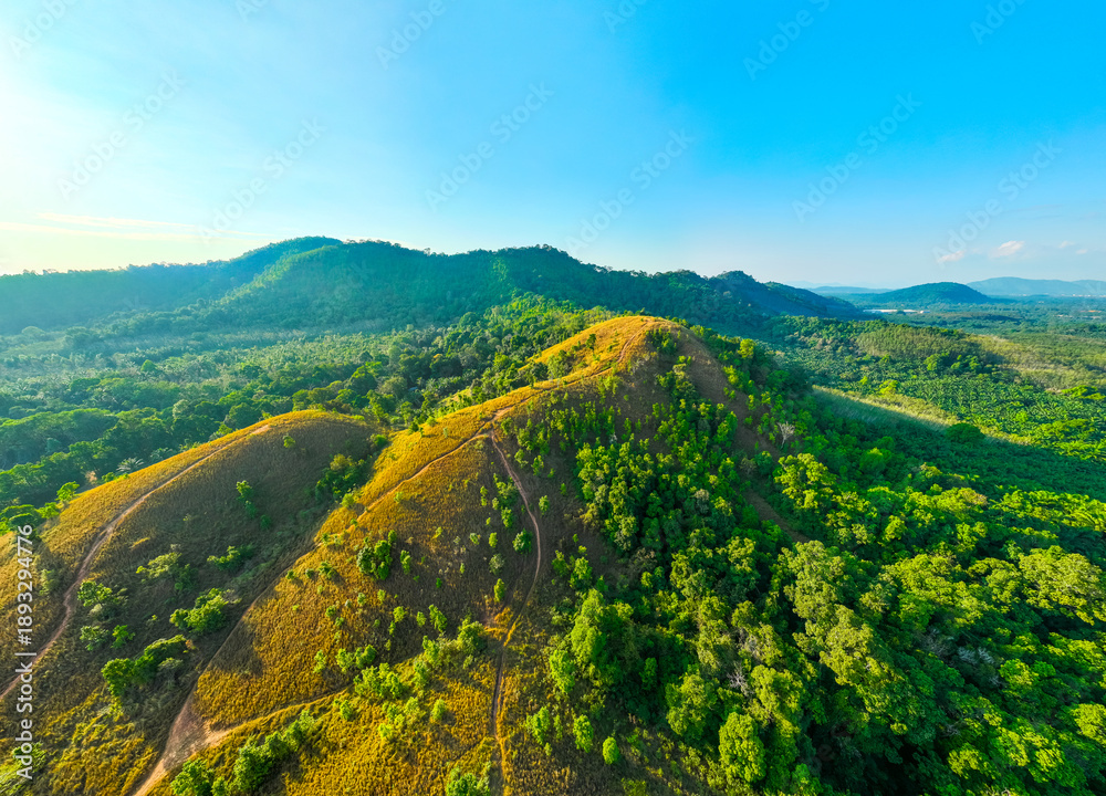 Obraz premium Aerial view mountains land and dry grass in ranong Thailand
