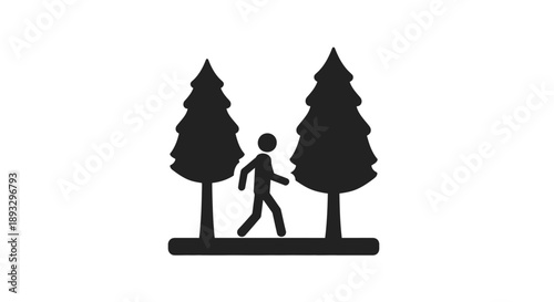 Silhouette of a person walking between two pine trees.