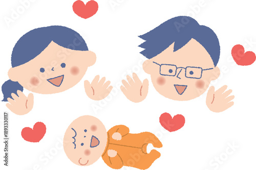 赤ちゃんを見つめる若い夫婦