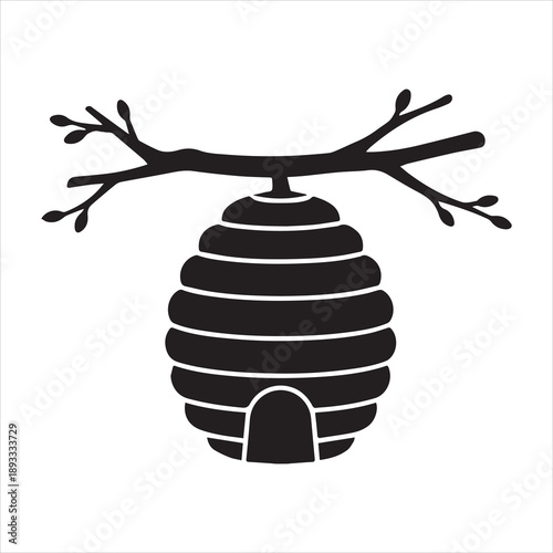 Rustic beehive on branch silhouette