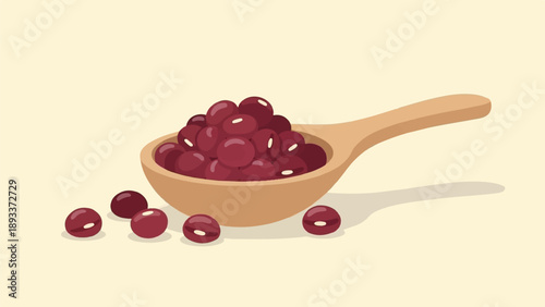 A wooden spoon filled with small red beans, with several beans scattered around it