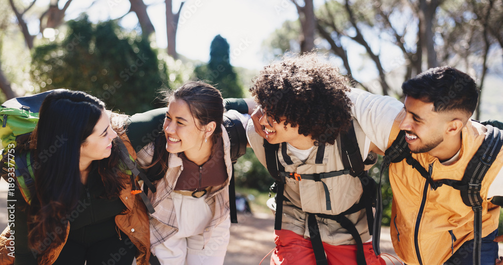 Fototapeta premium Smile, people and hug for hiking outdoor for fitness, adventure and bonding on holiday. Happy, friends and embrace for backpacking getaway, trekking reunion and group support for vacation in forest