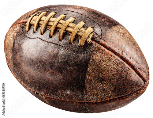 Worn American football.  Close-up of a vintage, leather football.  Brown leather shows signs of age and use.  Stitching is visible and weathered.  Oval shape