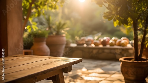 Rustic wooden table in garden with sunlight and blurred background