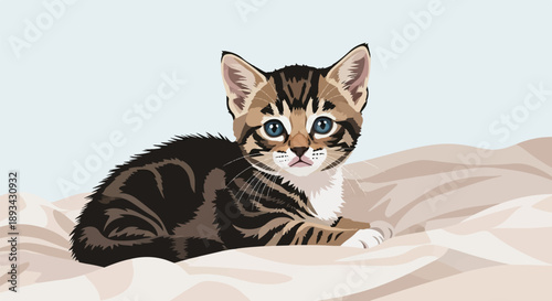 Adorable tabby kitten with bright blue eyes rests on soft, wrinkled fabric